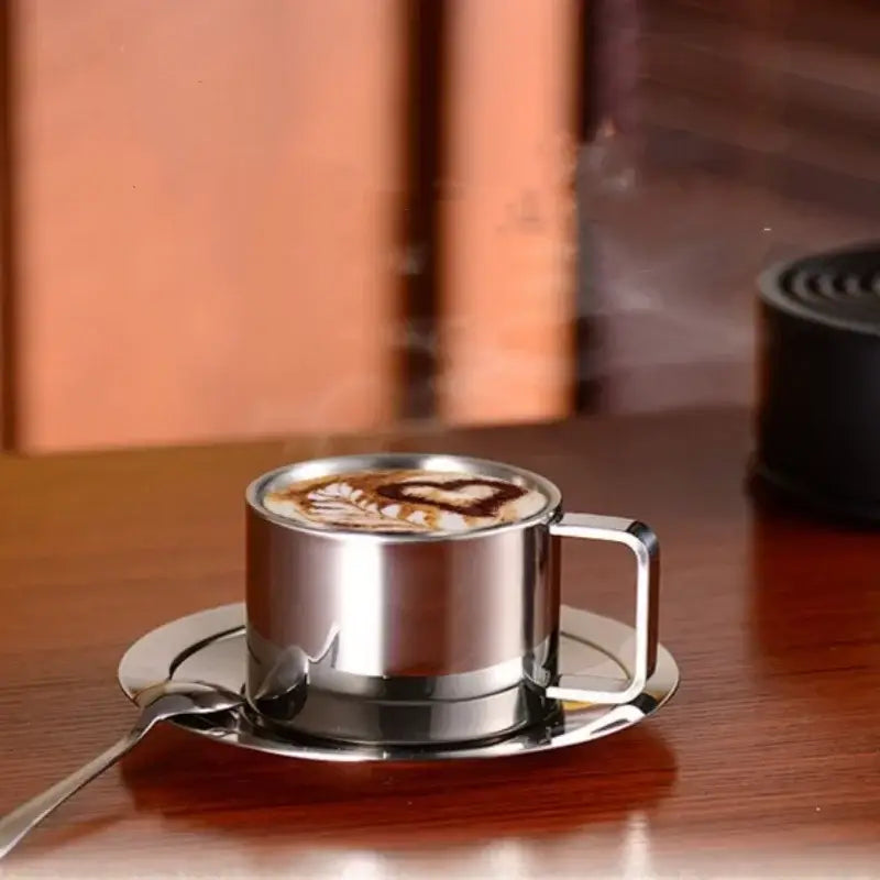 Close-up of stainless steel saucer and cup