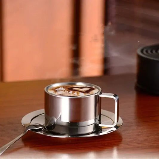 Close-up of stainless steel saucer and cup