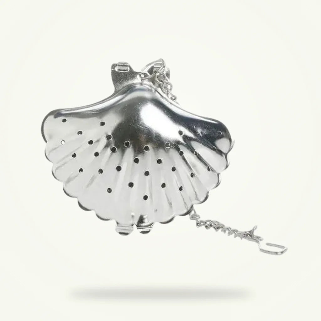 Stainless steel shell tea infuser, clamshell shape, product photo on plain background