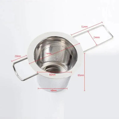 Tea infuser ball steeping in a clear glass mug of hot water