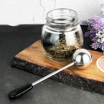 Close view of stainless steel tea infuser ball hinge and Magic Handle grip