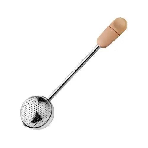 Rose pink stainless steel tea infuser ball with Magic Handle on wooden surface