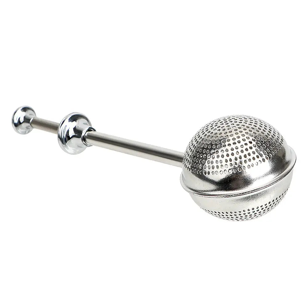 Tea infuser and mug on a wooden table