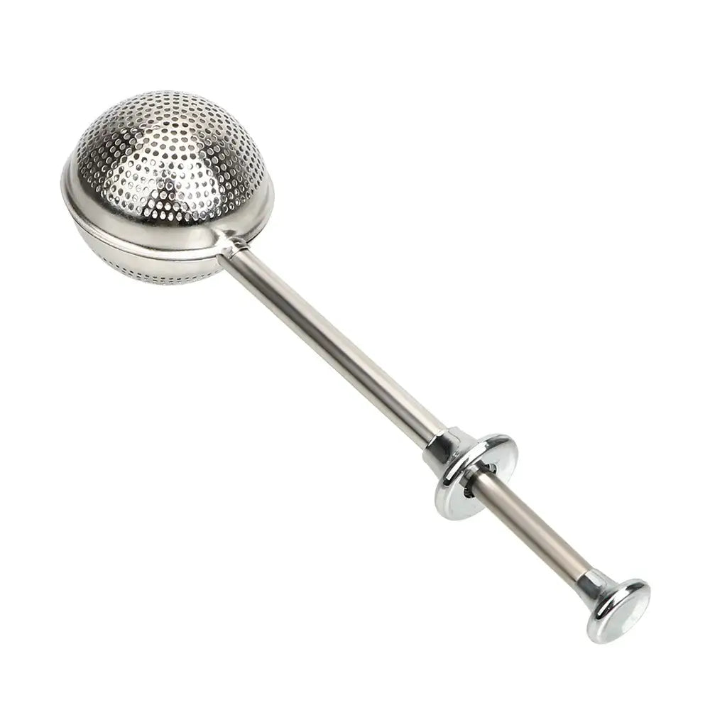 Tea infuser steeping in a clear glass mug