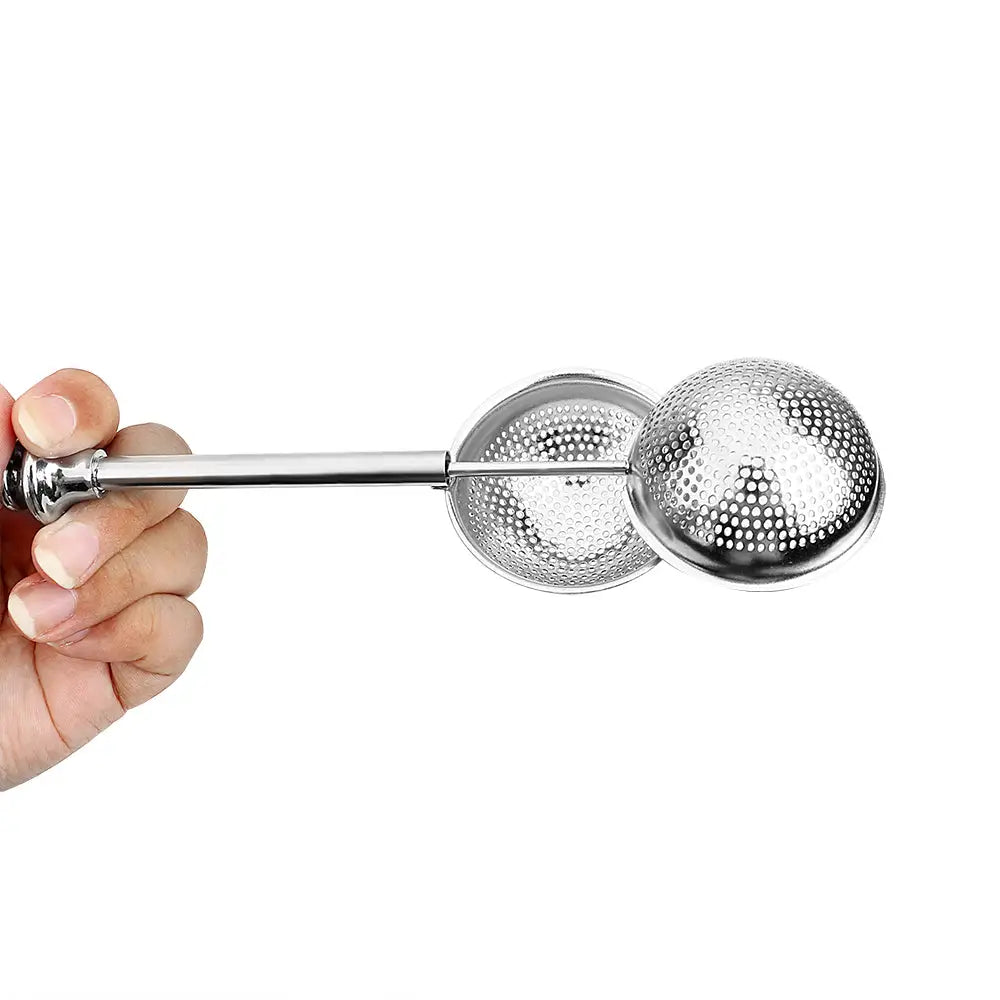 Tea infuser being removed from a mug