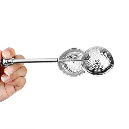 Tea infuser being removed from a mug