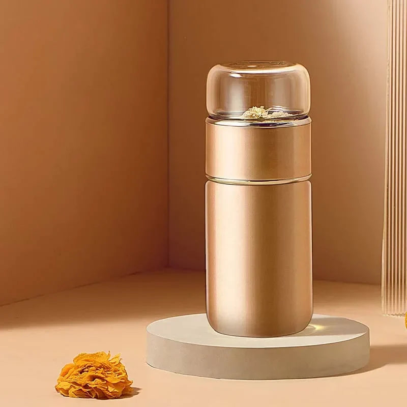 Glass lid detail showing loose-leaf tea steeping inside thermos