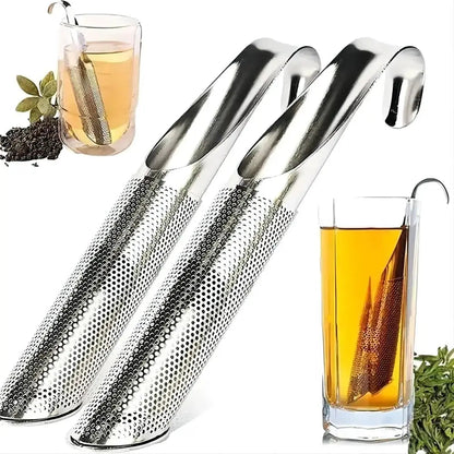 Fine-mesh stainless steel tea infuser with hook resting on mug rim