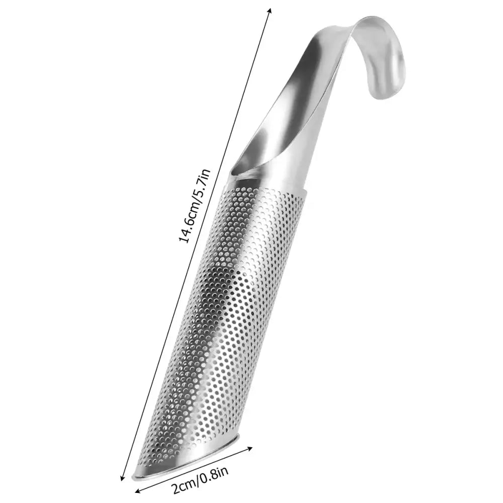 Hook of stainless steel tea infuser balanced on rim of white ceramic mug