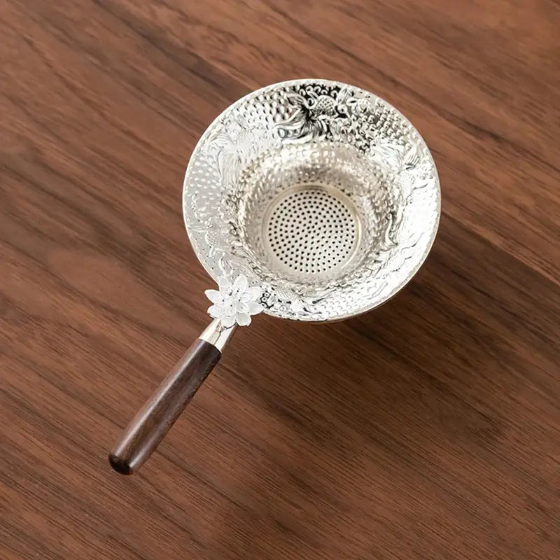 Tea strainer with drip tray in a gift box