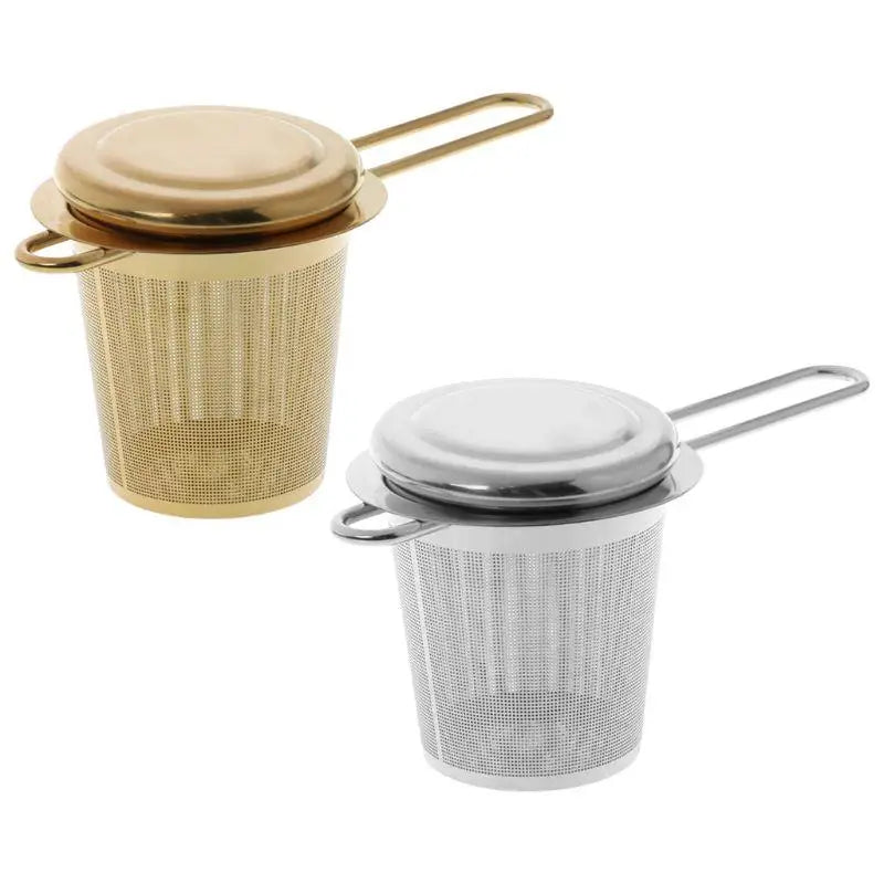 Stainless steel tea strainer with ergonomic handle resting over mug