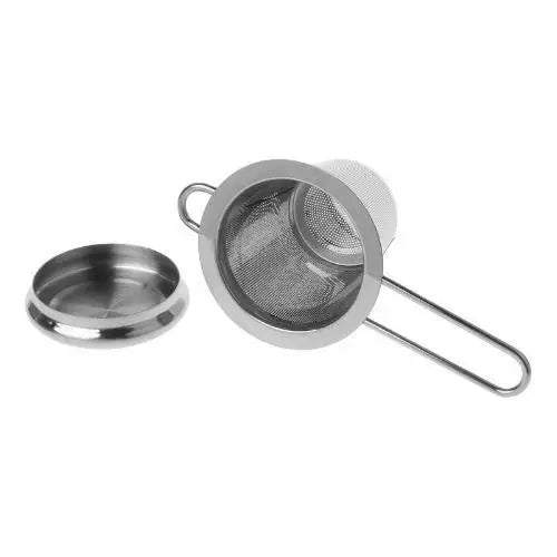 Gold-tone stainless steel tea strainer shown from above on counter