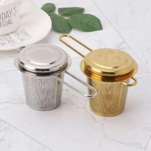 Stainless steel tea strainer in use pouring brewed loose-leaf tea
