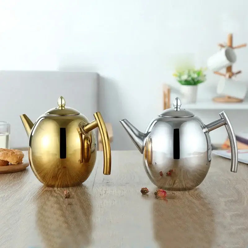 Stainless steel teapot sitting on an induction cooktop, front view