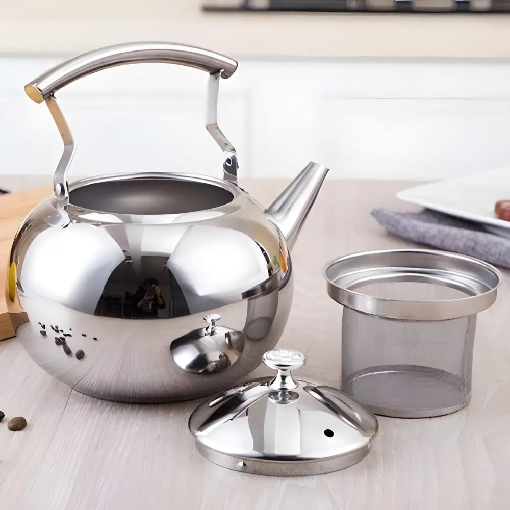 Close-up of built-in mesh filter inside stainless steel teapot for loose-leaf tea