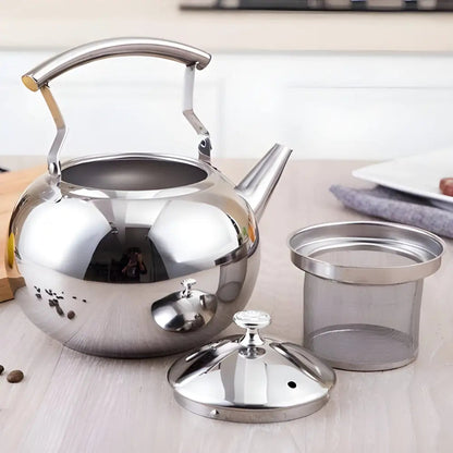 Close-up of built-in mesh filter inside stainless steel teapot for loose-leaf tea