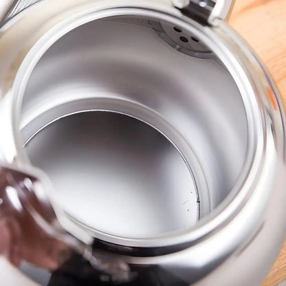 Interior view of stainless steel teapot showing integrated tea filter detail