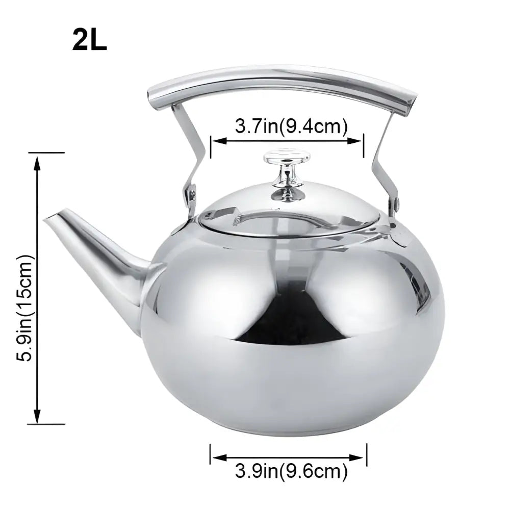 Stainless steel teapot pouring brewed loose-leaf tea into a white cup