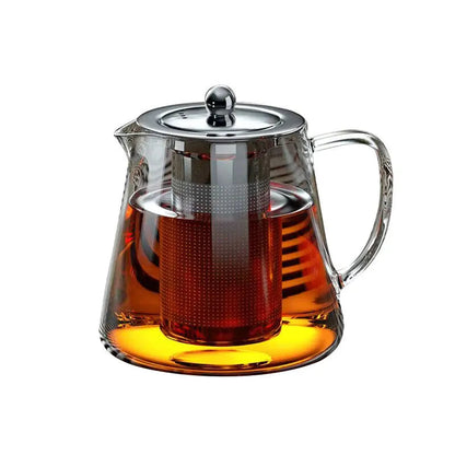 Stainless steel teapot with fitted lid and infuser basket, side view