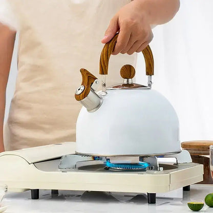 Whistling teapot with steam coming from spout