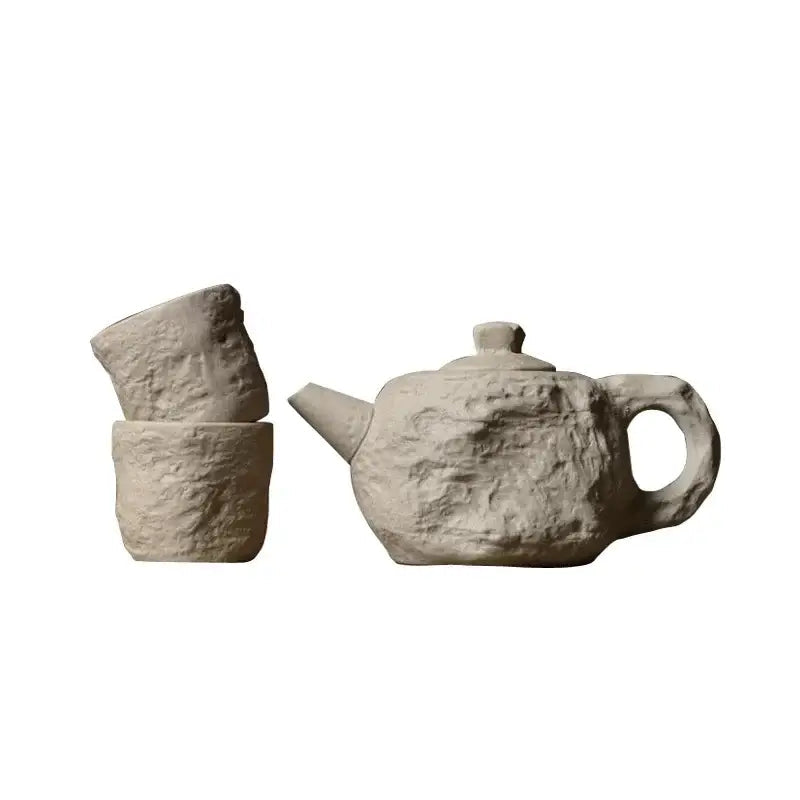 Full stone style tea set with teapot and two cups, side angle