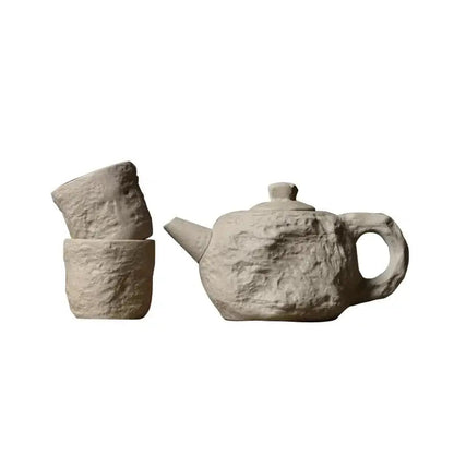 Full stone style tea set with teapot and two cups, side angle