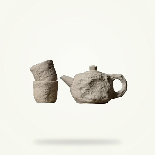 Stone style tea set with teapot and cups, full packshot on neutral background