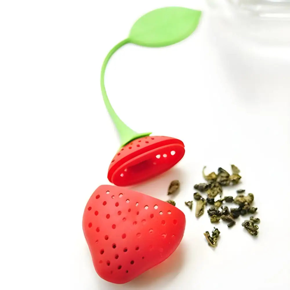 Strawberry silicone tea infuser in use inside a white mug