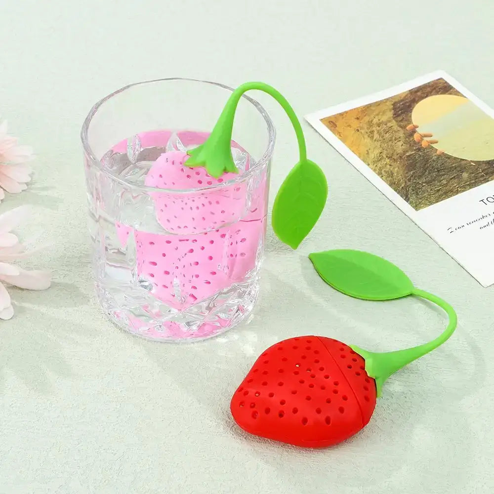 Strawberry tea infuser on saucer