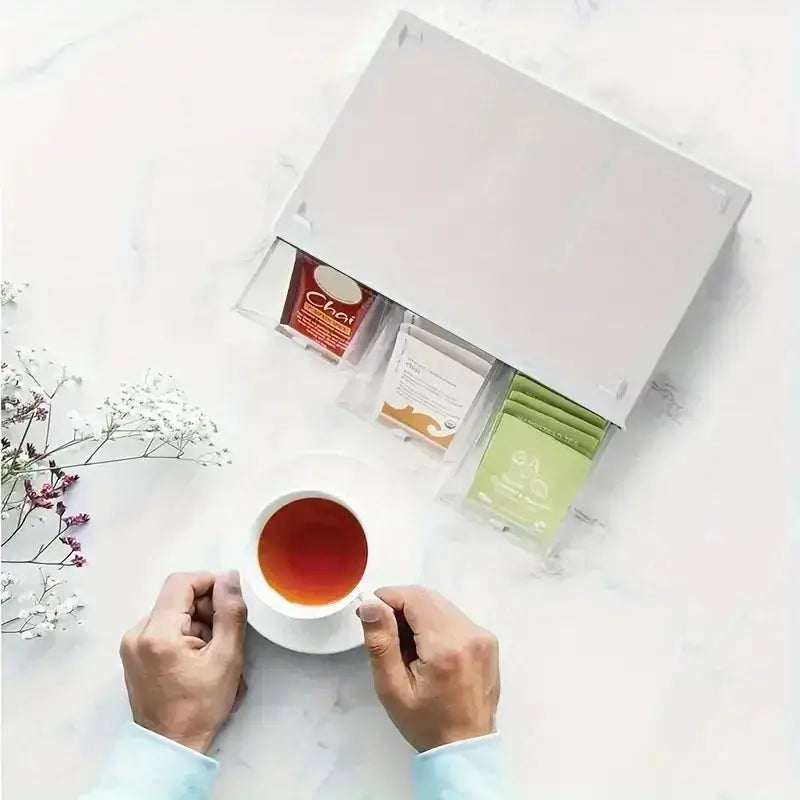 White tea bag drawer organizer box filled with assorted tea bags in compartments