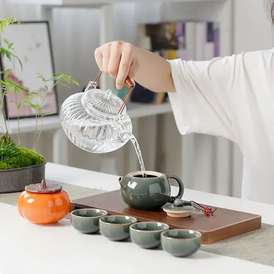 Complete ceramic tea set gift box open showing teapot and cups inside