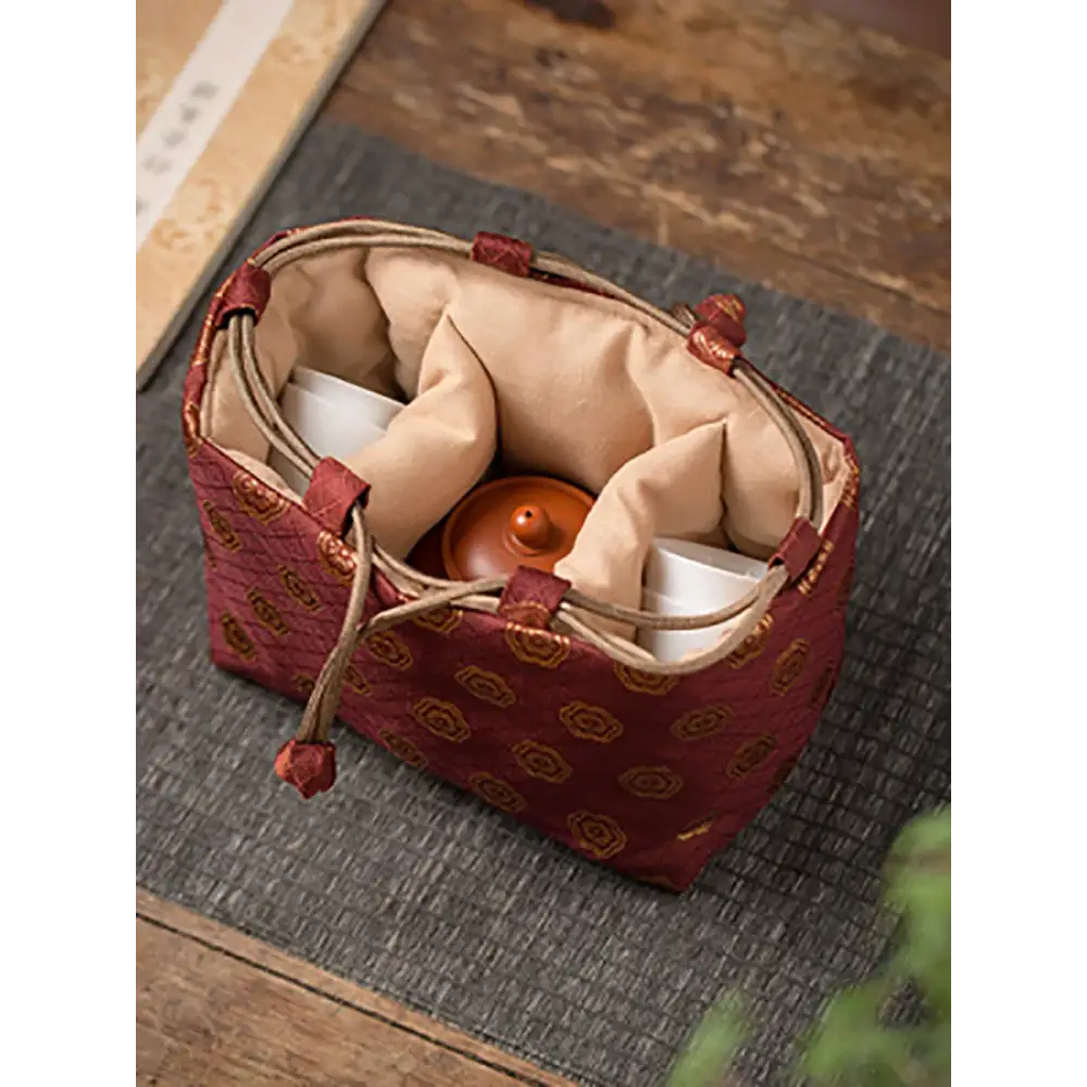 Tea set travel bag with drawstring closed, ready for transport