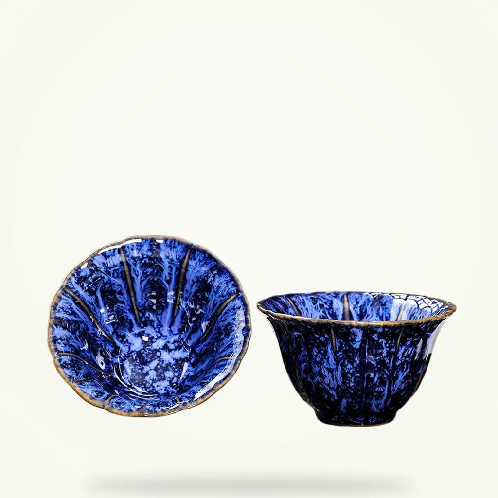 Tenmoku Glaze Tea Cup, product photo on a plain background