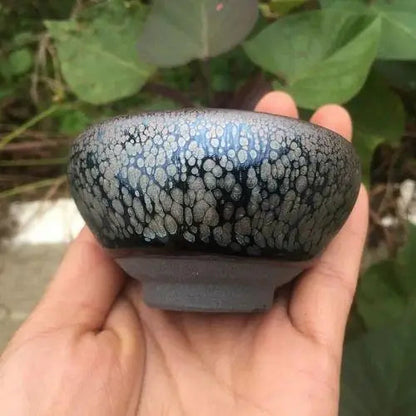 Handcrafted tenmoku ceramic cup for matcha, showing thick stoneware walls