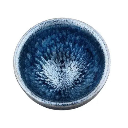 Tenmoku tea ceremony bowl showing deep black-brown glaze and wide open rim
