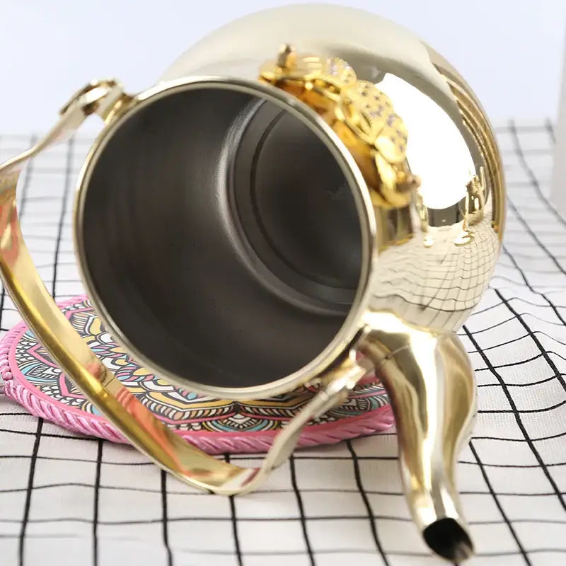 Stainless steel Arabic teapot for induction, side profile showing spout curve