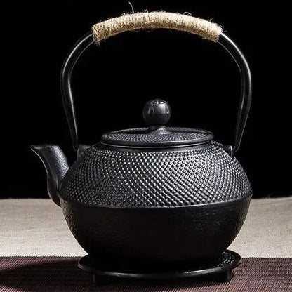 Black cast iron teapot side view