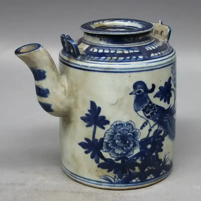 Porcelain teapot with classic floral pattern, side view