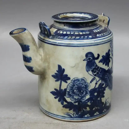 Porcelain teapot with classic floral pattern, side view