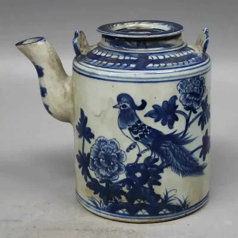 Traditional porcelain teapot with lid and handle
