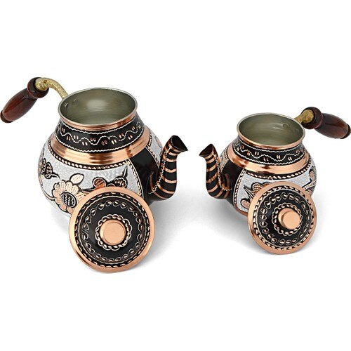 Turkish copper teapot set on a wooden table, both pots side by side