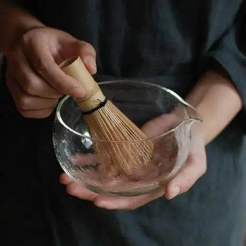 Glass chawan tea bowl with bamboo whisk for matcha