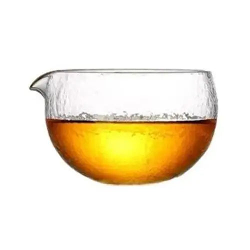 Clear glass chawan tea bowl on wooden table