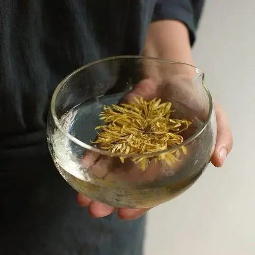 Transparent chawan bowl filled with brewed tea