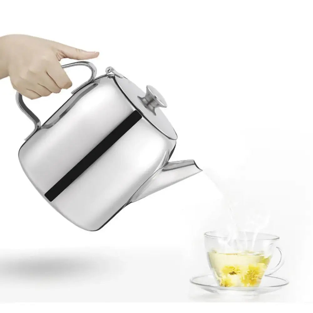 Stainless steel teapot with built-in infuser displayed near stovetop