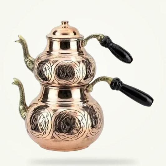 Turkish copper double-decker teapot set for authentic çay, packshot on plain background