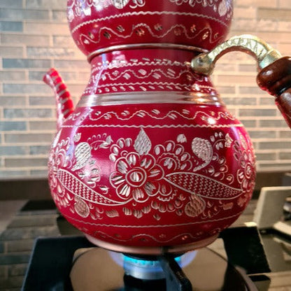 Turkish teapot on stove with steam
