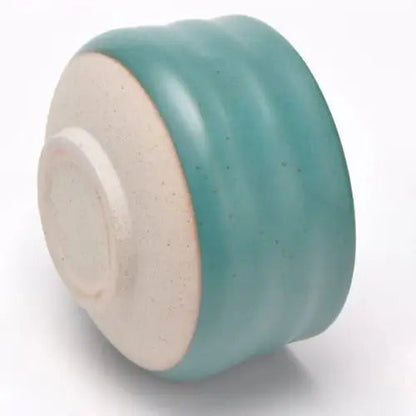 Bottom of turquoise chawan tea bowl showing glaze