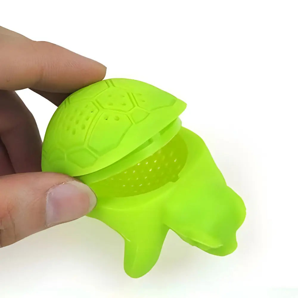 Turtle tea infuser in use steeping loose leaf tea in a mug