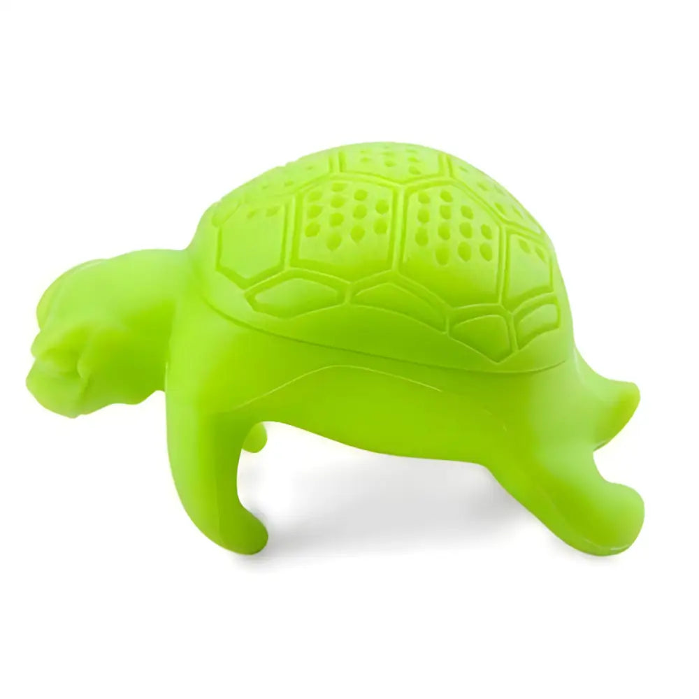 Green silicone turtle tea infuser shown from above on light background